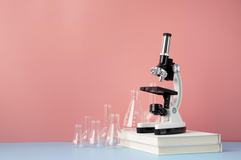 world science day arrangement with microscope copy space